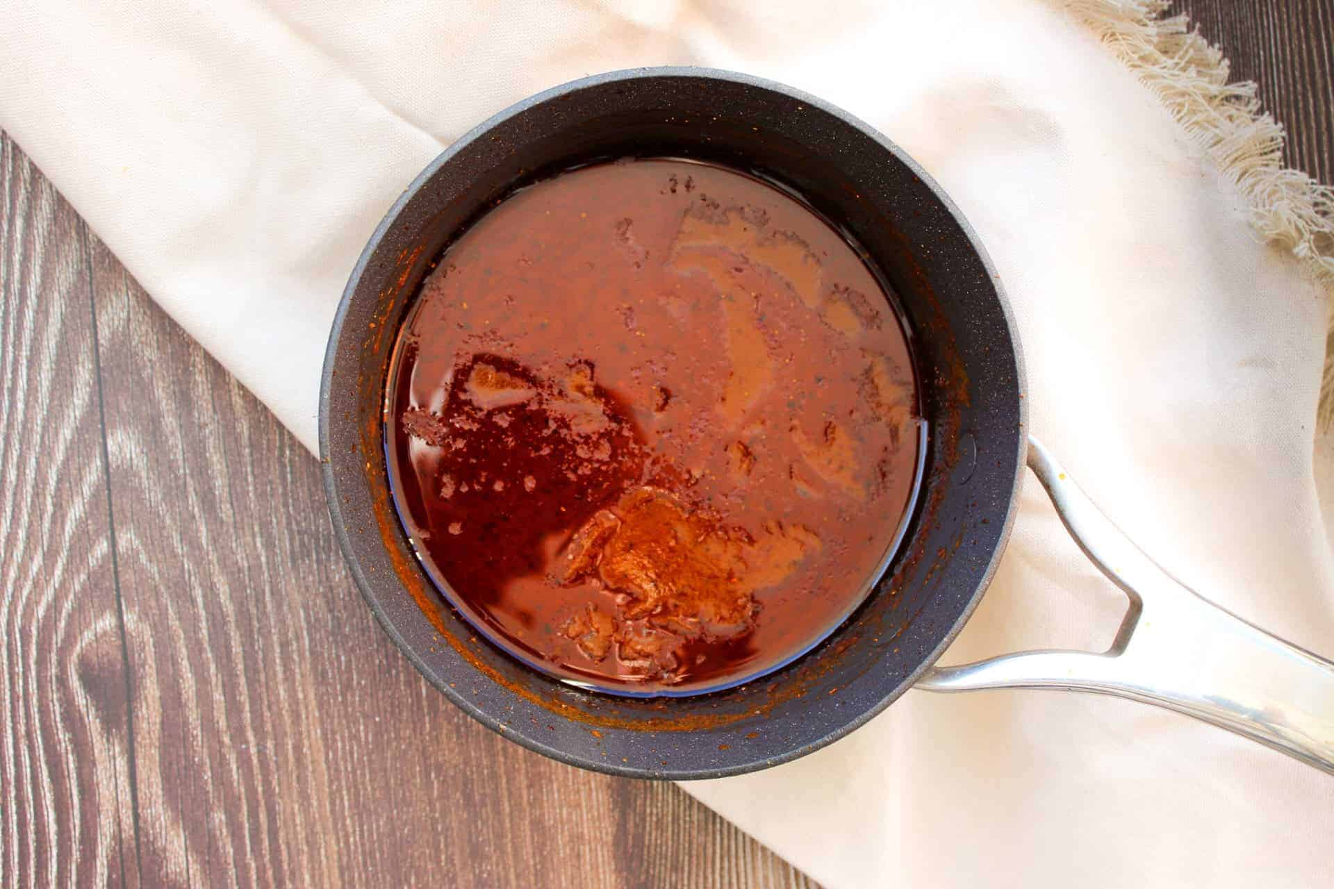 Buffalo sauce in a small saucepan. 