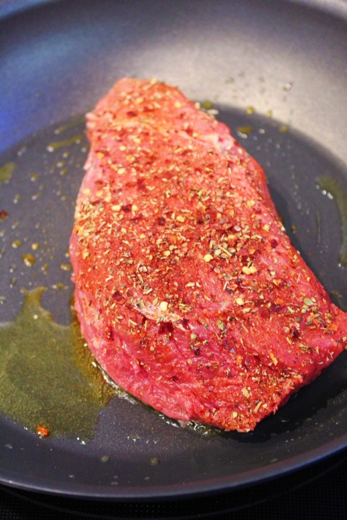 searing meat in skillet