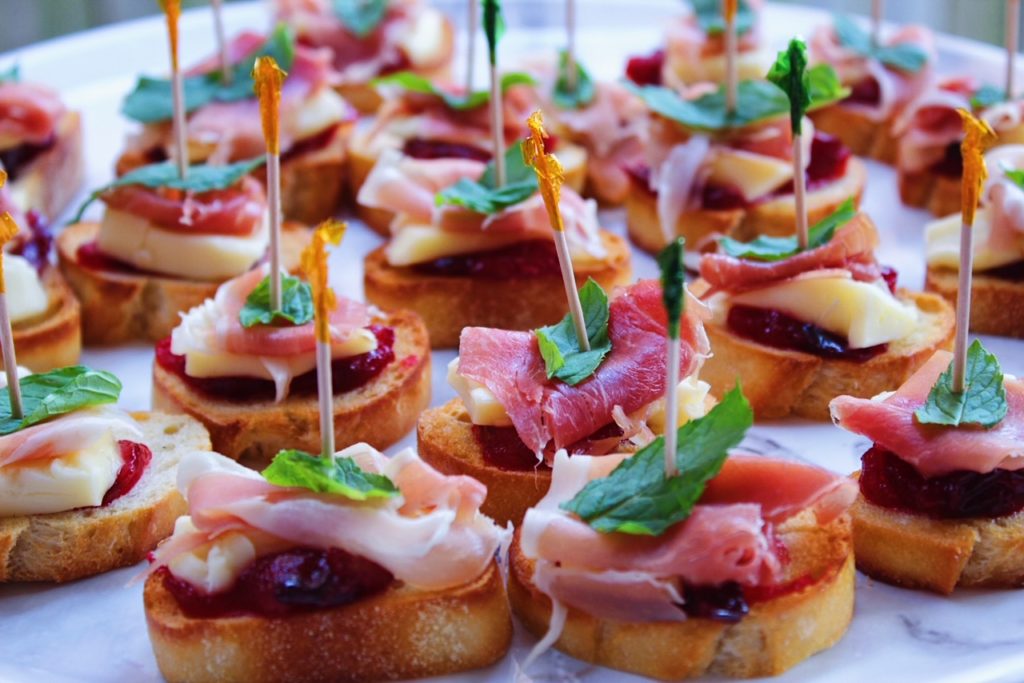 Brie & Prosciutto Crostini with Cranberry and Mint