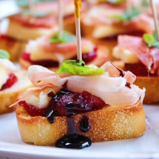 Brie & Prosciutto Crostini with Cranberry and Mint close up