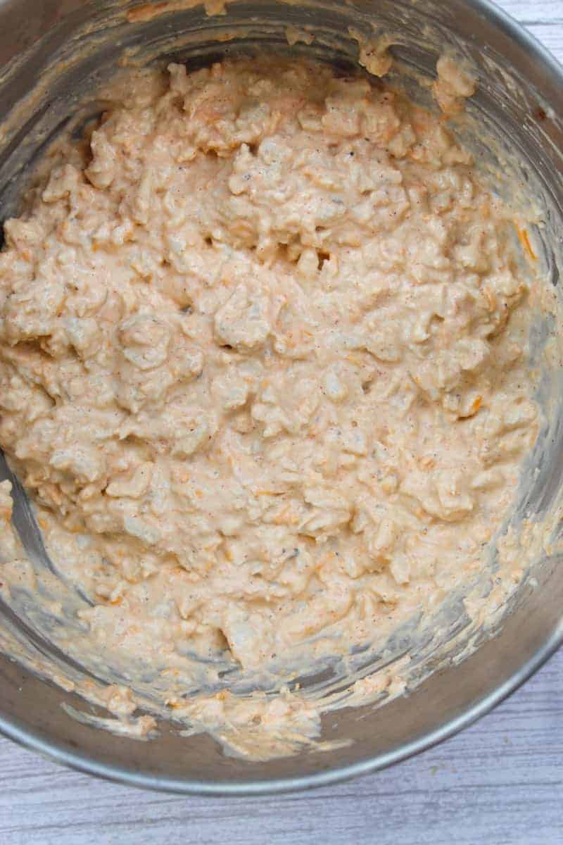 Ingredients mixed together in large silver mixing bowl.