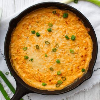 Hot Cajun Crab Dip served in cast-iron skillet.