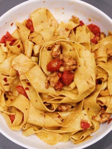 Lobster Pappardelle in white bowl.