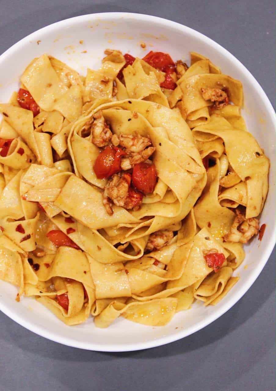 Lobster pasta in a white bowl. 