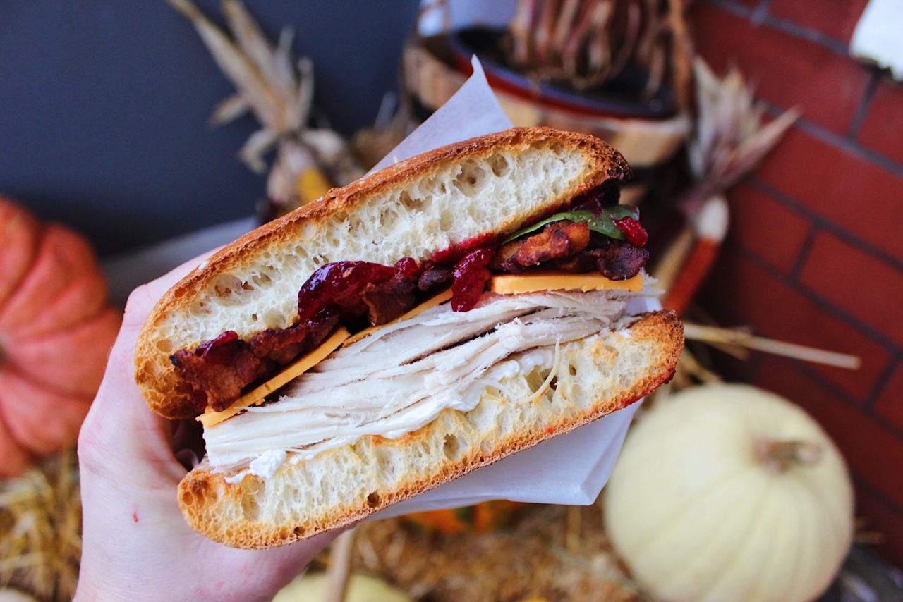 turkey sandwich in front of fall backdrop