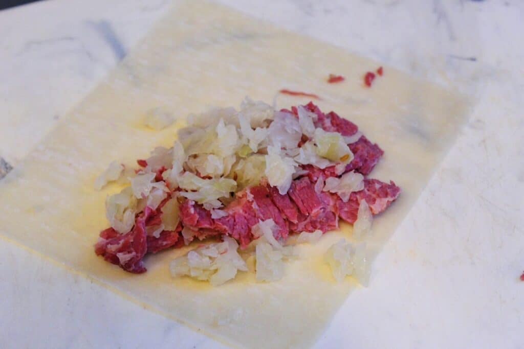 Corned beef and sauerkraut on egg roll wrapper.