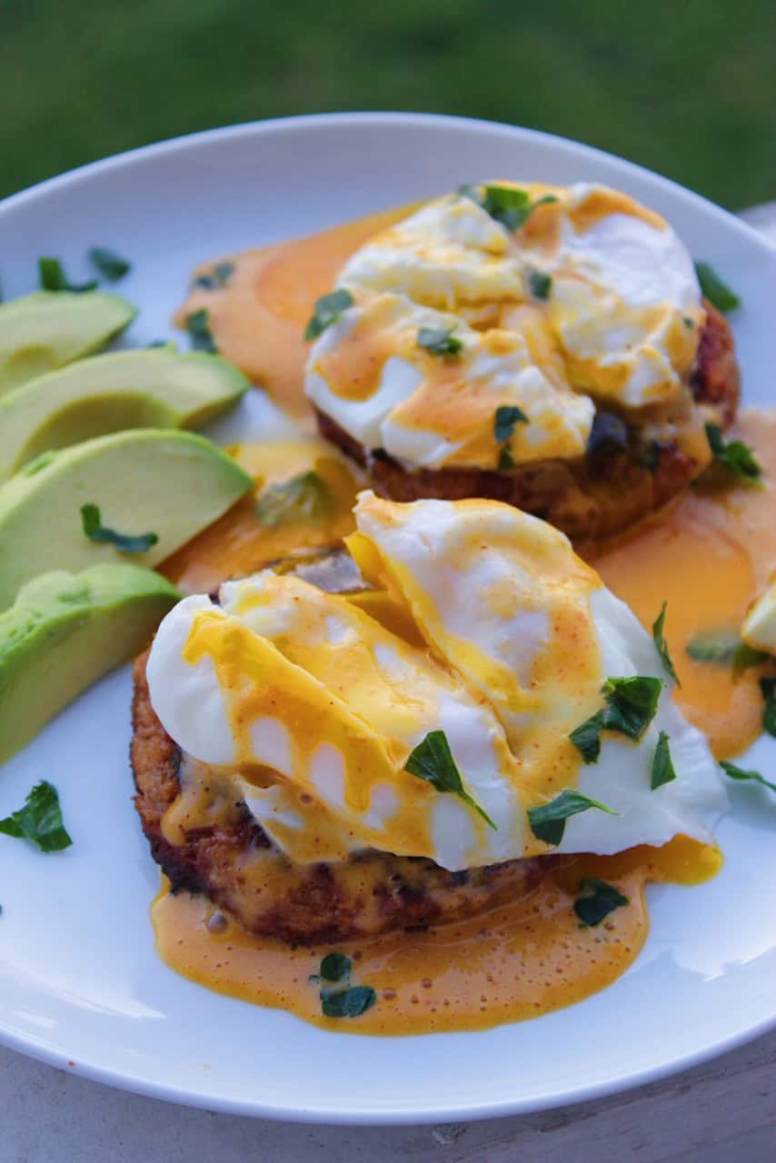 Sliced poached eggs with hollendaise sauce over crab cakes.