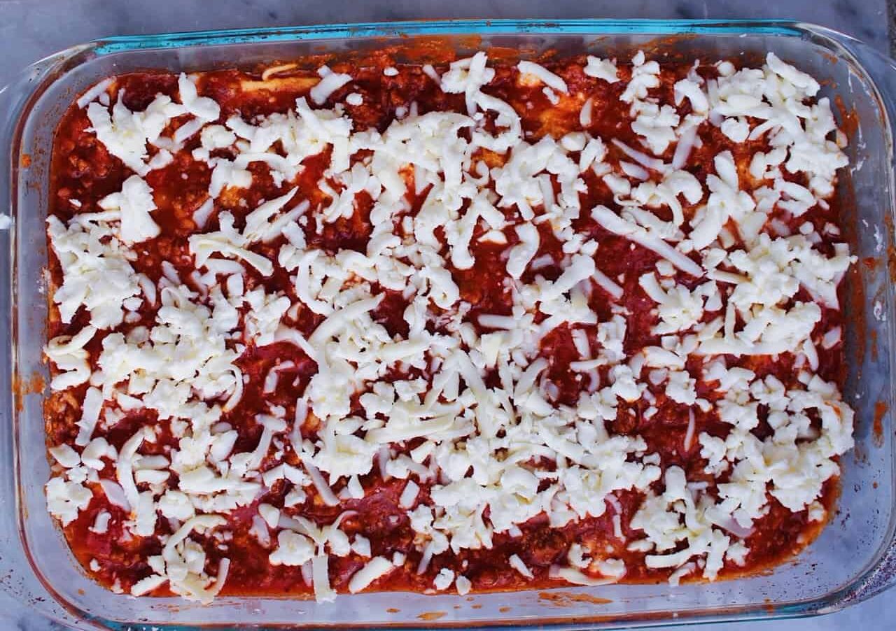 Mozzarella layer over red meat sauce.