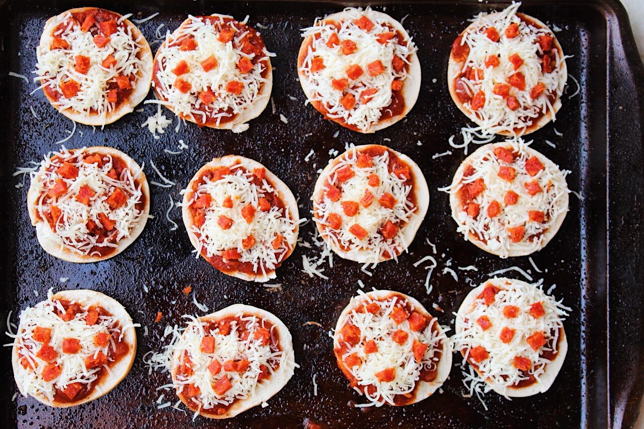 Mini bagels stacked with marinara sauce, mozzarella and pepperoni.